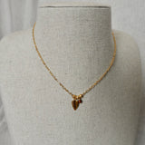 Pendentif feuille et oeil de taureau