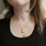 Bell and pearl pendant